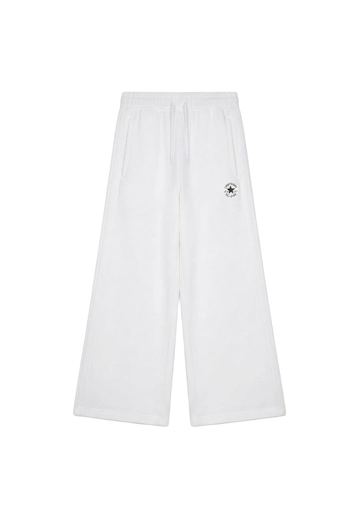 Pantaloni bianchi Converse bambina vista frontale con logo